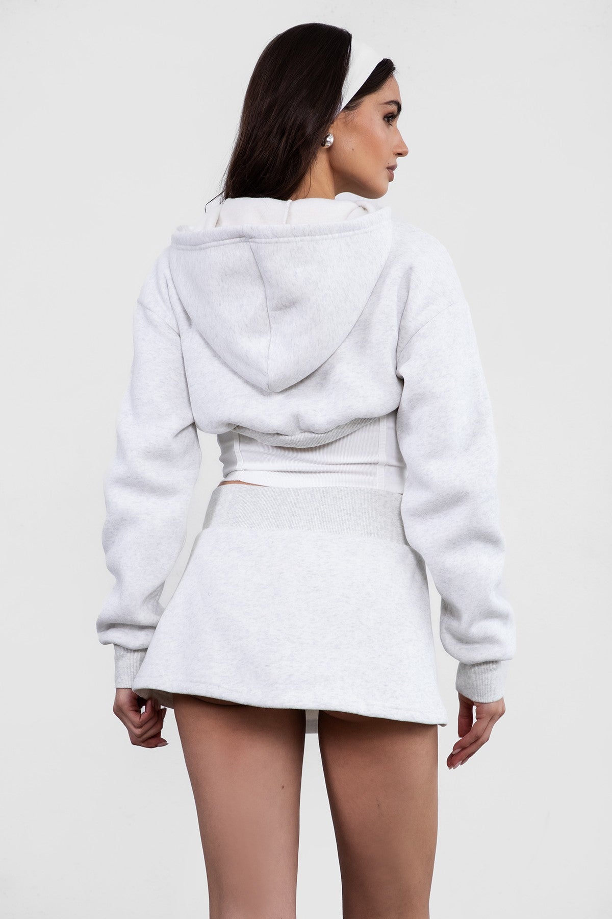 heather  White fleece bolero-style cardigan featuring a cropped fit and zipper front by Tic Toc.