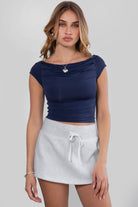  Navy off the shoulder short sleeve top with high boat neck and ruching by Tic Toc.