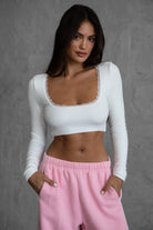 White ribbed long sleeve crop top with lace trims from Tic Toc, ultra-cropped and fitted.