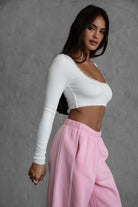 White ribbed long sleeve crop top with lace trims from Tic Toc, ultra-cropped and fitted.