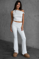 Heather white foldover flare leggings by Tic Toc, featuring a low-rise waist and smooth stretch fabric.