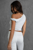 Dual-layered heather white one shoulder top with hip length fit and stylish design by Tic Toc.