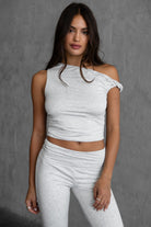  Heather white one shoulder top with asymmetrical neckline and twist strap by Tic Toc.