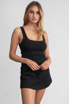 Black fleece mini skirt featuring a drawstring waist and pull-on design from Tic Toc.