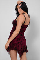  Burgundy mini dress featuring a scoop neckline, tie front detail, and ruffled hem from Tic Toc.