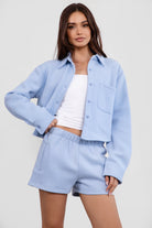 Baby blue high-waisted fleece shorts with soft fabric and reversible side pockets from Tic Toc.