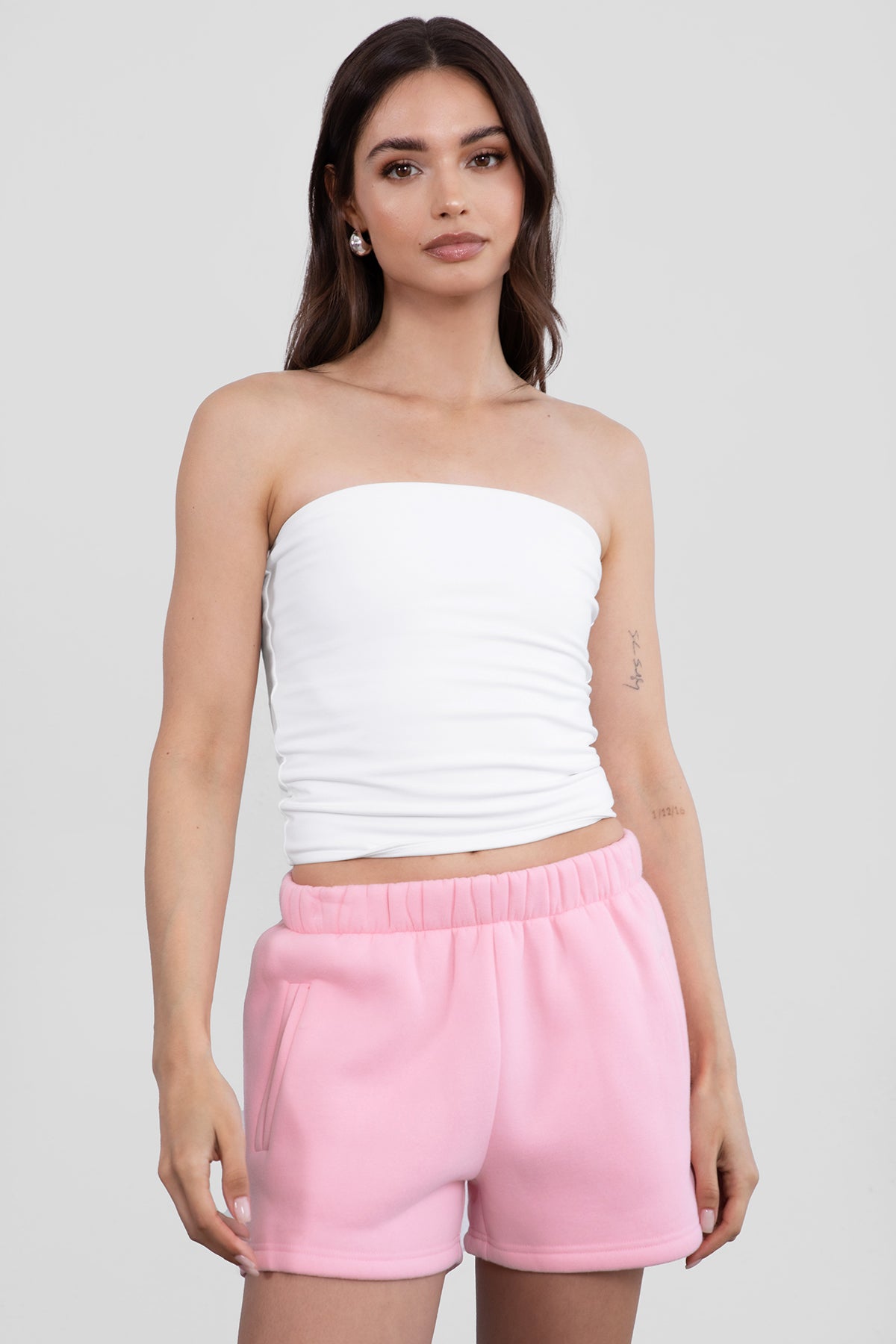 Blush pink fleece shorts featuring a relaxed straight-leg fit and smooth texture from Tic Toc.