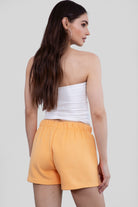 Bright orange fleece shorts with a relaxed fit and reversible side pockets by Tic Toc.