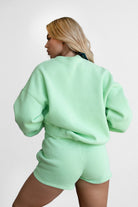 Pastel lime fleece high-waist shorts, great for lounging with a soft, smooth fabric by Tic Toc.