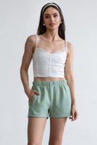 Sage green fleece shorts with a cozy fleece texture and high-waisted fit, perfect for lounging by Tic Toc.