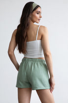 Sage green fleece shorts with a cozy fleece texture and high-waisted fit, perfect for lounging by Tic Toc.