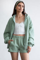 Sage green fleece shorts with a cozy fleece texture and high-waisted fit, perfect for lounging by Tic Toc.