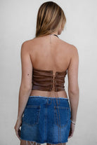 TIC TOC TA29069 BECKEE PU Vegan Leather Corset Top in distressed leather. Features a straight strapless neckline, rhinestone western detail, and lace-up back in color brown. 