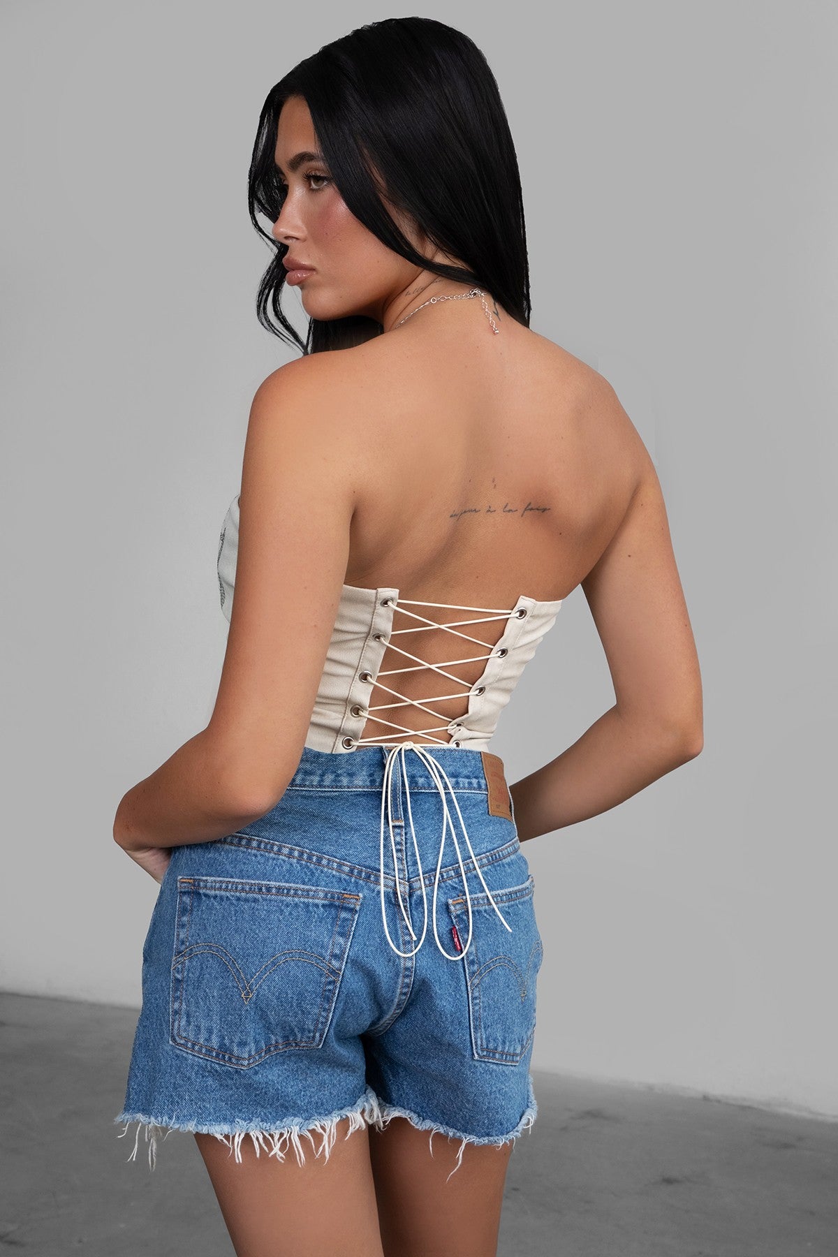 TIC TOC TA29069 BECKEE  PU Vegan Leather Corset Top. Featuring embroidered western details, and an exposed lace up back. Perfect for bold, edgy, and Western-inspired looks.