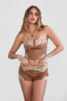 TIC TOC TA30268 MONTANA Embroidered Suede Bustier Top in soft suede with floral embroidery, button-front closure, and asymmetrical hem. Western-inspired festival top