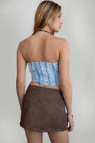 TIC TOC TA30488 FRAYE Distressed Denim Bustier. A strapless cropped corset top with frayed distressed denim edges and a hook-and-eye closure.