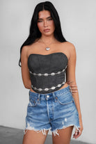 TIC TOC TA30530 GLENDORA Distressed PU Leather Corset Top in black. Features a sweetheart neckline, boned structure, silver western embellishments, and an adjustable satin lace-up back.