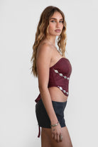 TIC TOC TA30530 GLENDORA Distressed PU Leather Corset Top in red. Features a sweetheart neckline, boned structure, silver western embellishments, and an adjustable satin lace-up back.