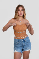 TIC TOC TA30530 GLENDORA Distressed PU Leather Corset Top in tan. Features a sweetheart neckline, boned structure, silver western embellishments, and an adjustable satin lace-up back.