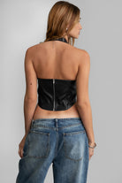 TIC TOC TA30680 DIXY PU Vegan Leather Corset Top. A dark red halter-neck leather top featuring studded details, an exposed back zipper, and a curved hem.