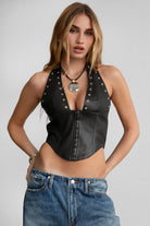 TIC TOC TA30680 DIXY PU Vegan Leather Corset Top. A dark red halter-neck leather top featuring studded details, an exposed back zipper, and a curved hem.