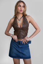 TIC TOC TA30680 DIXY PU Vegan Leather Corset Top. A dark red halter-neck leather top featuring studded details, an exposed back zipper, and a curved hem.