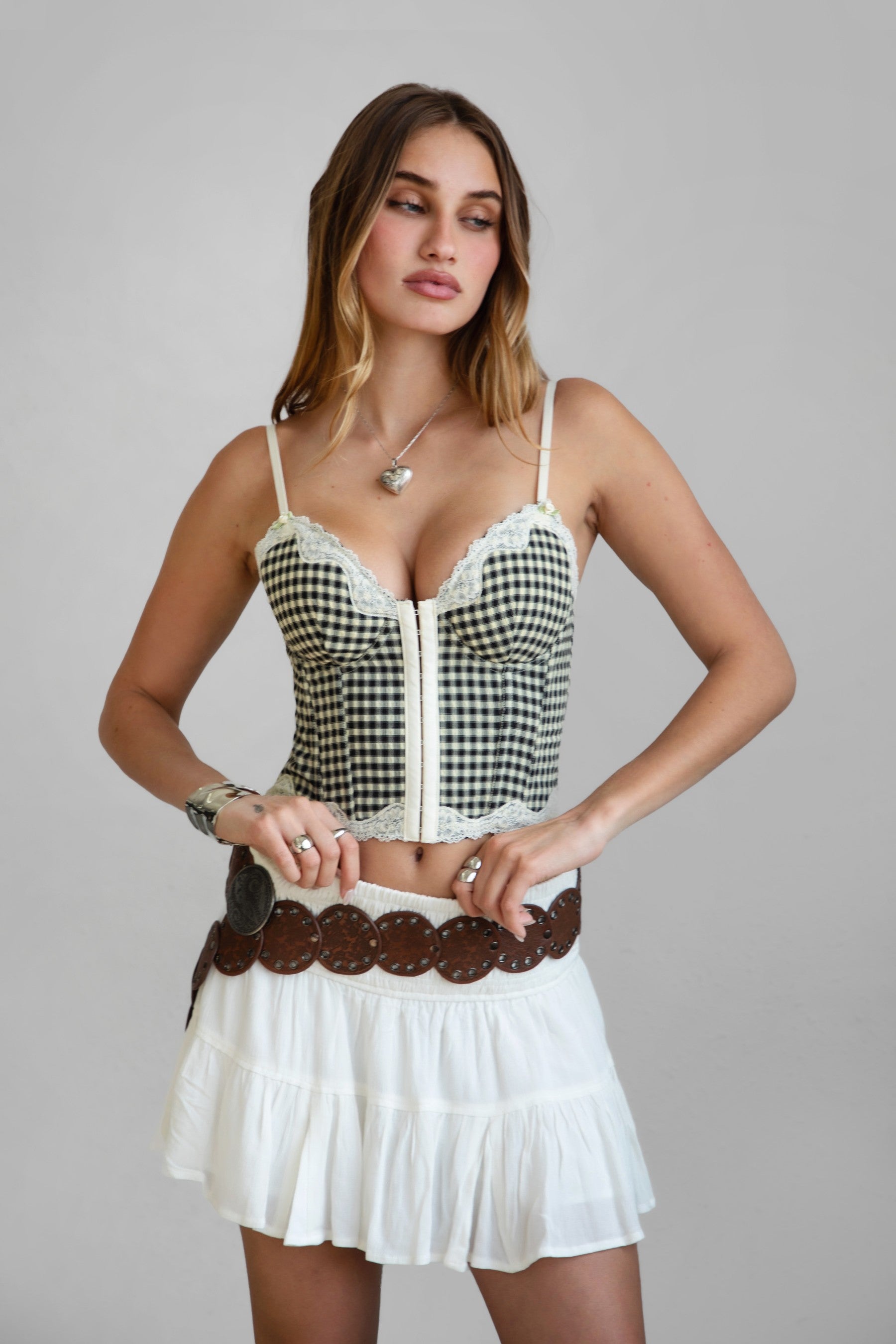 TIC TOC TA30829 BETSI Gingham Crepe Chiffon Bustier. Features lace trim, rosette details, adjustable spaghetti straps, and a lace-up back. Perfect for western festival outfits.