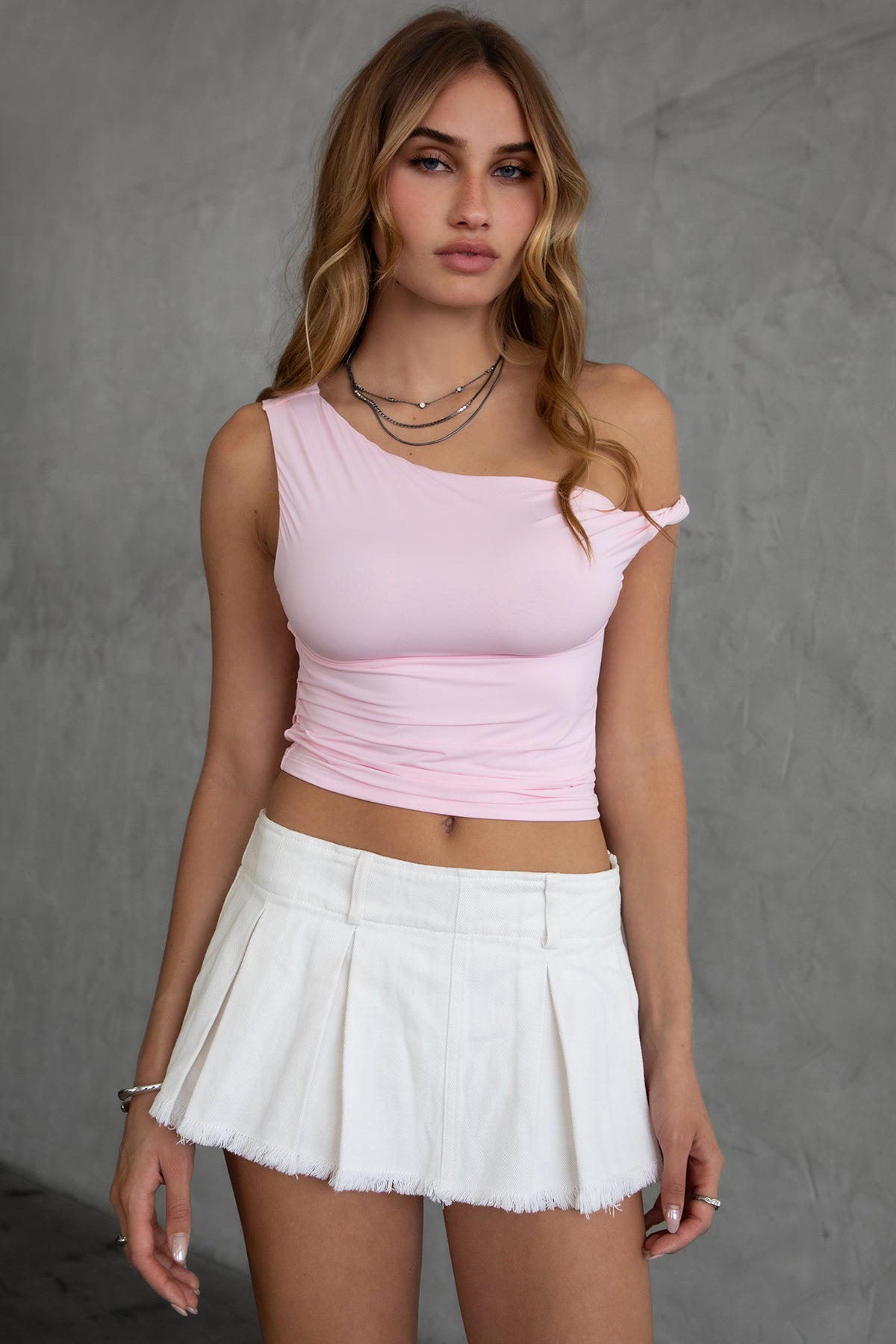 Pink one shoulder top featuring a sleek, modern design by Tic Toc.