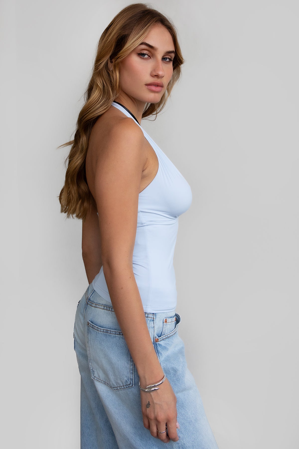 Baby blue halter cami top with sleek spandex fabric and fitted silhouette by Tic Toc.