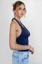 blue halter cami top with sleek spandex fabric and fitted silhouette by Tic Toc.