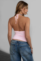 Pink halter cami top by Tic Toc featuring a low V neckline and open back.