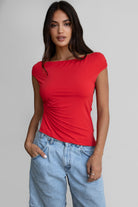 Cherry red off the shoulder asymmetric top with silver ring and long hem by Tic Toc.