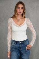 TIC TOC TH30959 ANNALEE Long Sleeve Lace Top. Features a sheer floral lace design, scoop neckline, and stretch fabric. A perfect layering piece for a chic bohemian look.