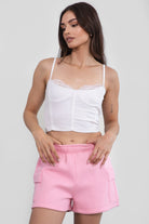 Pink mid-rise fleece shorts featuring an elastic waistband and cargo-style pockets by Tic Toc.