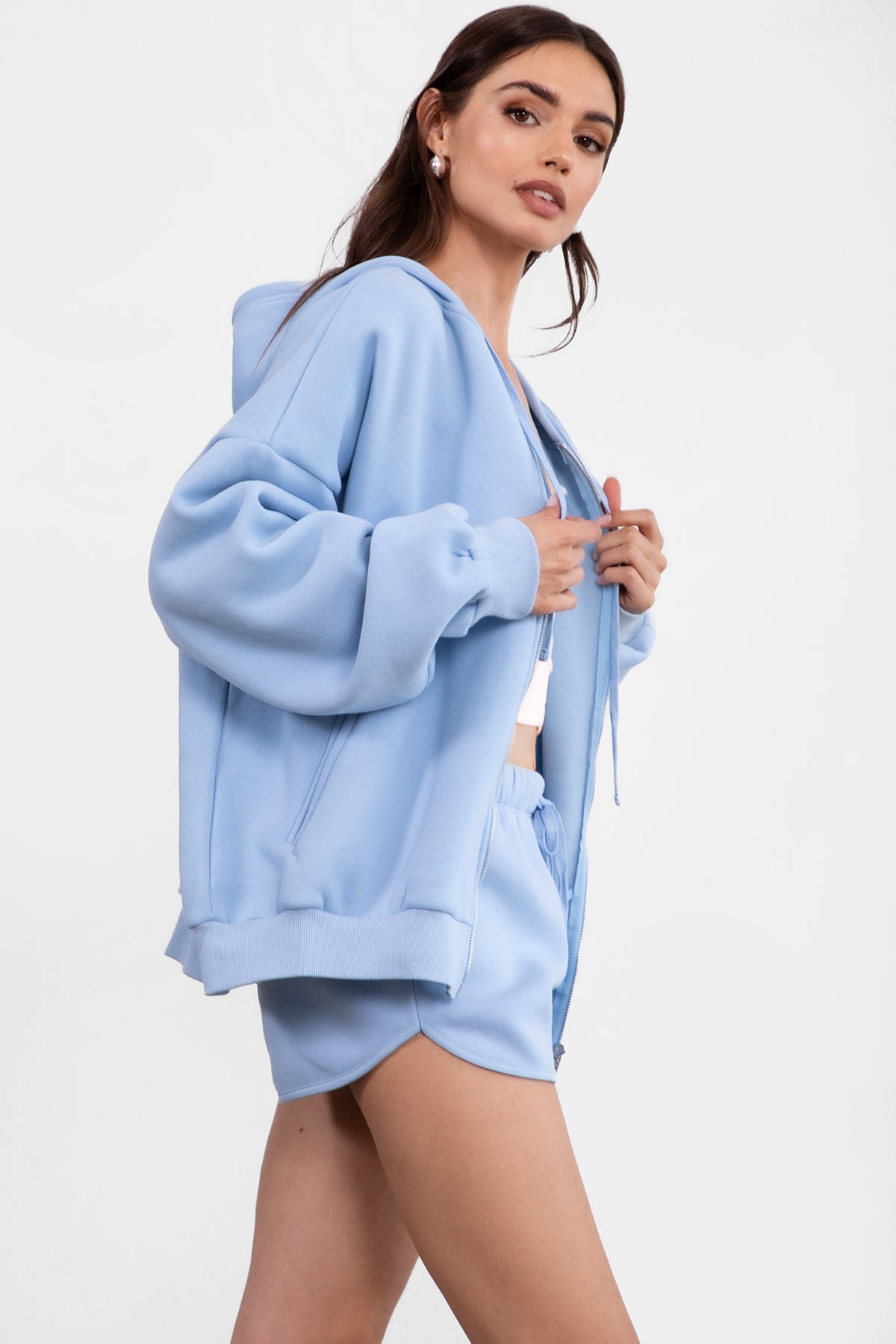 Baby blue fleece zip-up hoodie featuring a relaxed fit and dropped shoulder design from Tic Toc.