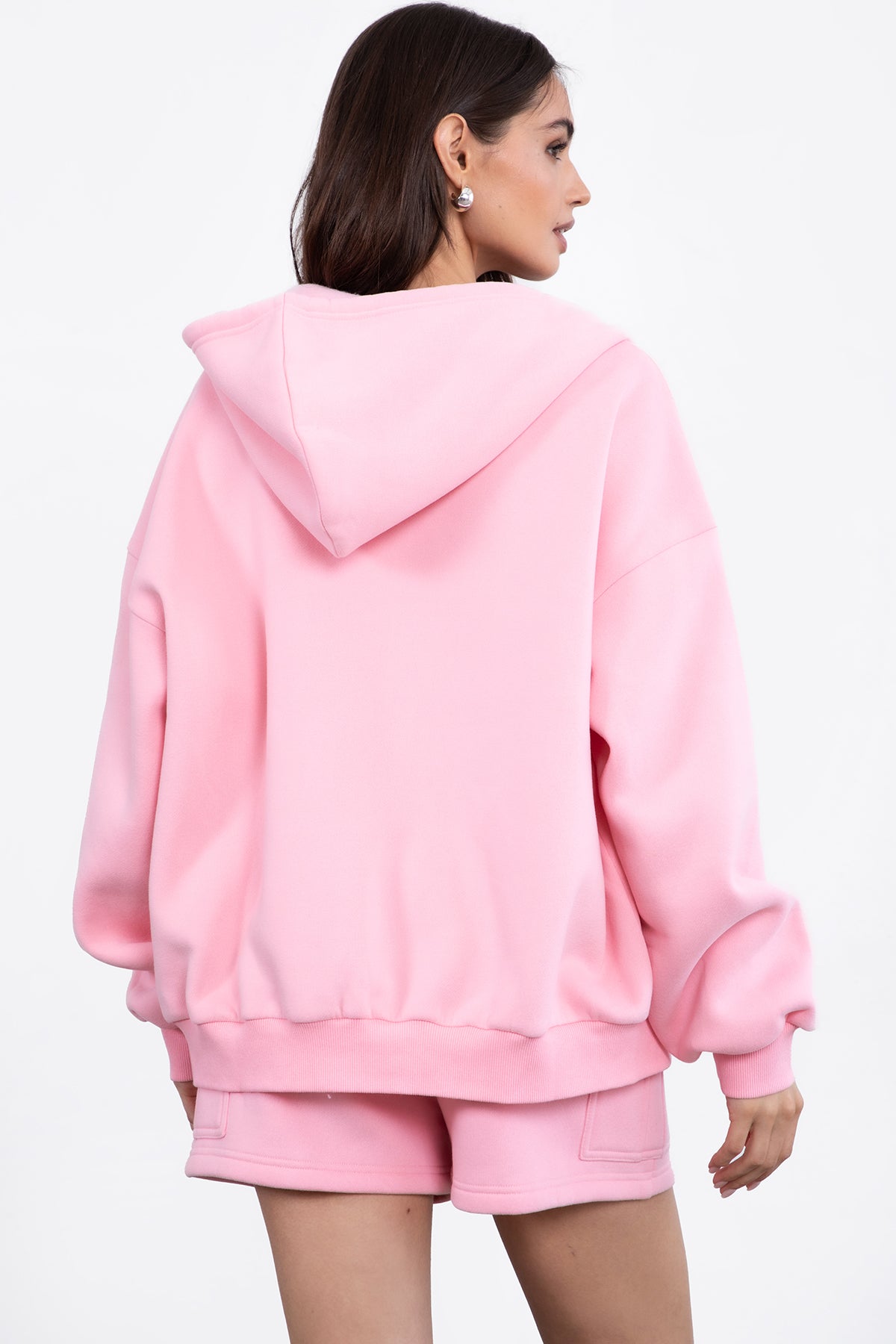  Blush pink oversized hoodie with a full zipper and adjustable drawstring for a cozy feel by Tic Toc.