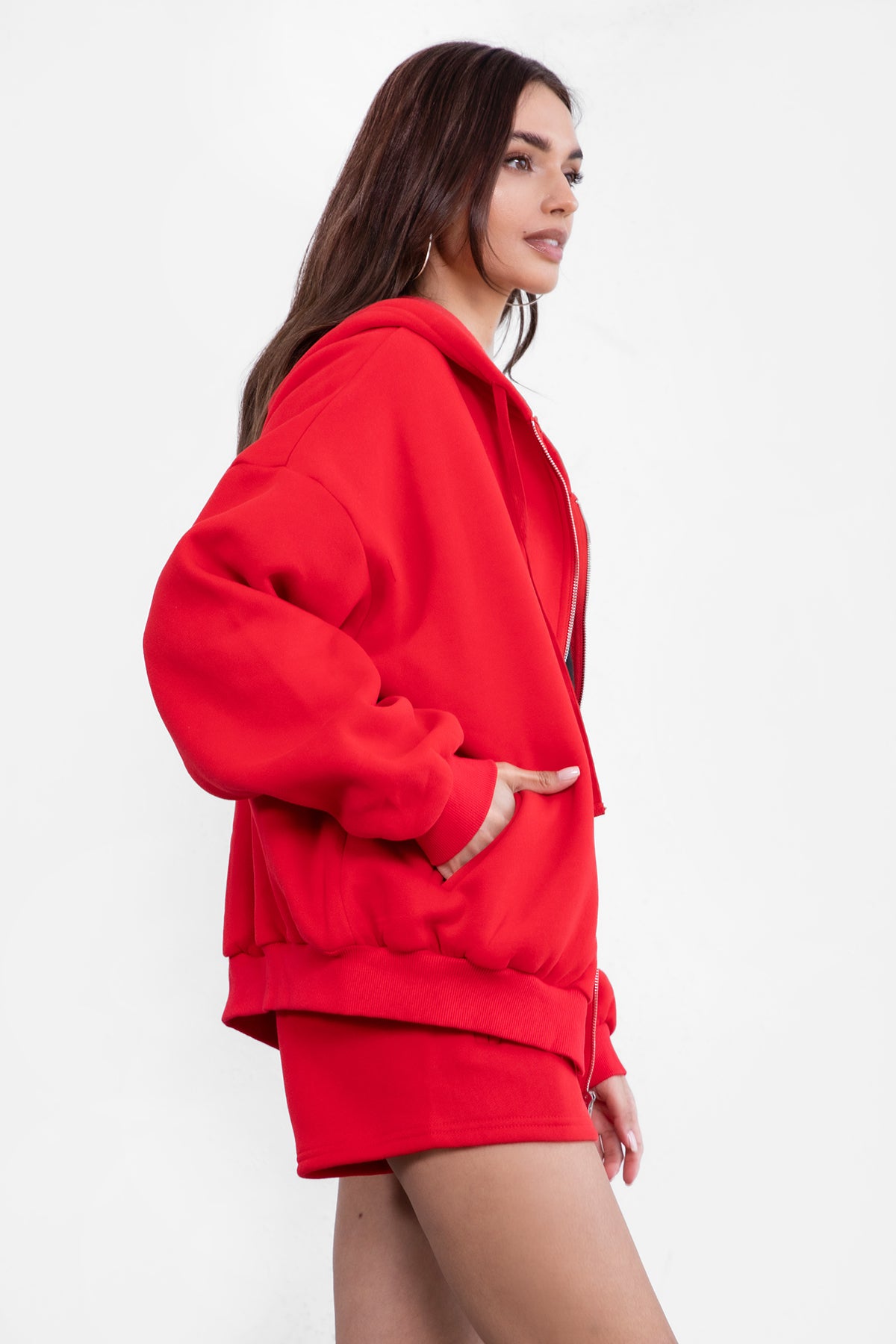 Cherry red zip-up hoodie with ribbed cuffs and a thick fleece texture, designed for comfort by Tic Toc.