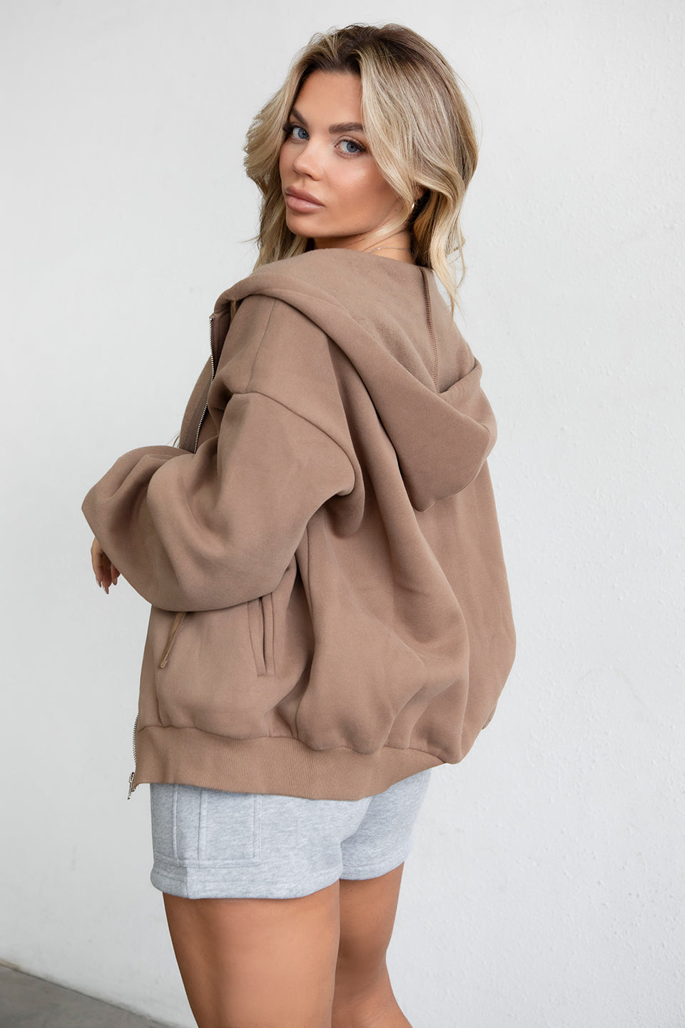 Coffee-colored oversized zip-up hoodie featuring a soft fleece texture and hidden drawstring by Tic Toc.