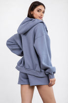  French blue oversized fleece hoodie with a functional zipper and ribbed hem, perfect for layering by Tic Toc.