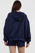  Navy oversized zip-up hoodie with a smooth fleece texture, great for layering during cool weather by Tic Toc.