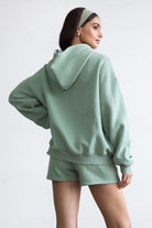  Sage green oversized zip-up hoodie featuring a functional zipper and a smooth, soft fleece texture by Tic Toc.