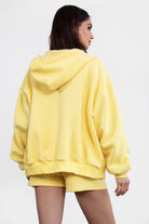  Yellow oversized zip-up fleece hoodie featuring a relaxed fit and adjustable drawstring hood by Tic Toc.