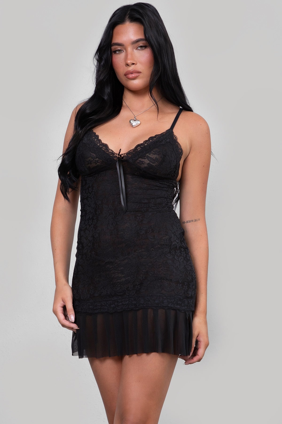 TIC TOC black lace mini dress featuring adjustable straps and a sweetheart neckline