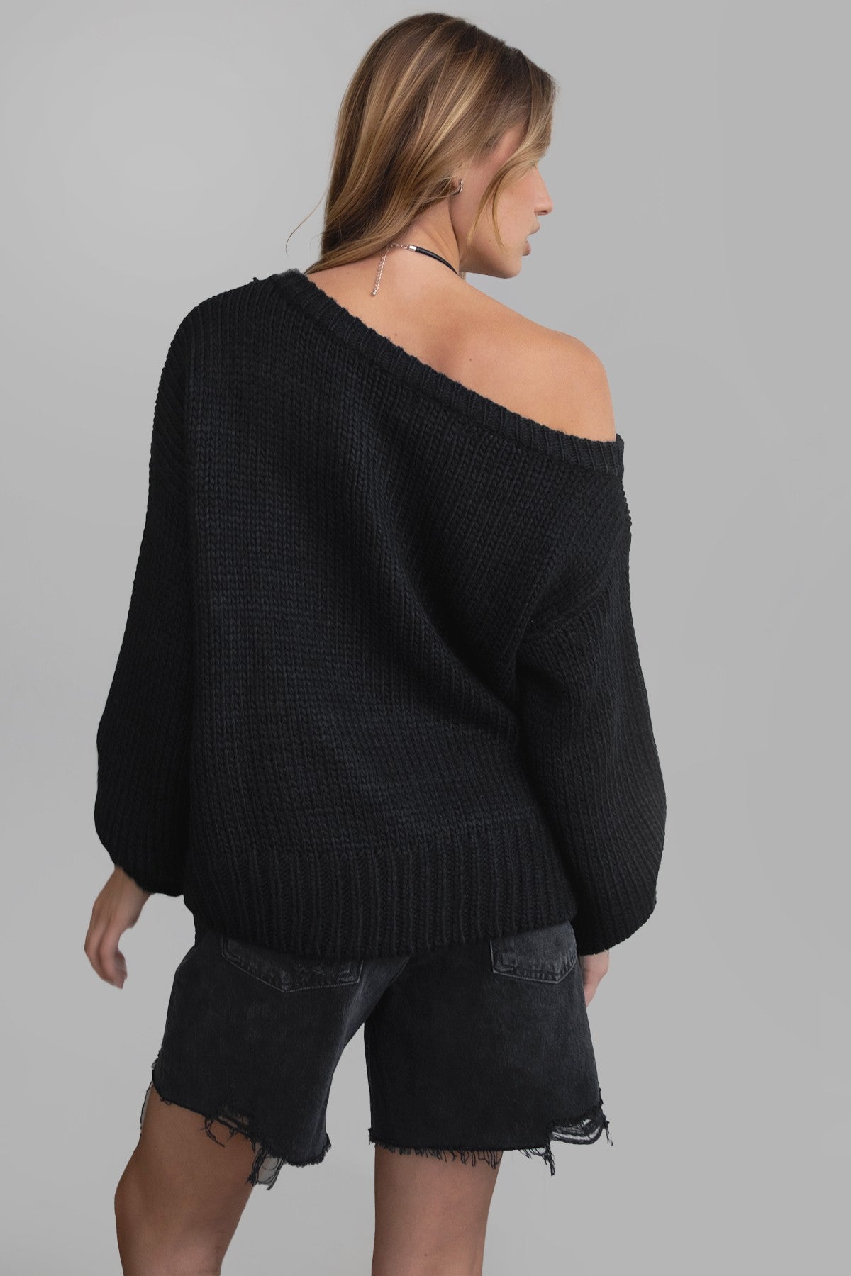 BRANDY off-the-shoulder ribbed knit sweater in black with long loose sleeves