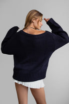 BRANDY off-the-shoulder ribbed knit sweater in black with long loose sleeves