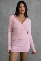 Blush COZEE two-piece knit loungewear set featuring a fold-over skirt and ribbed cuffs