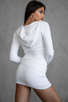 white COZEE two-piece knit loungewear set featuring a fold-over skirt and ribbed cuffs