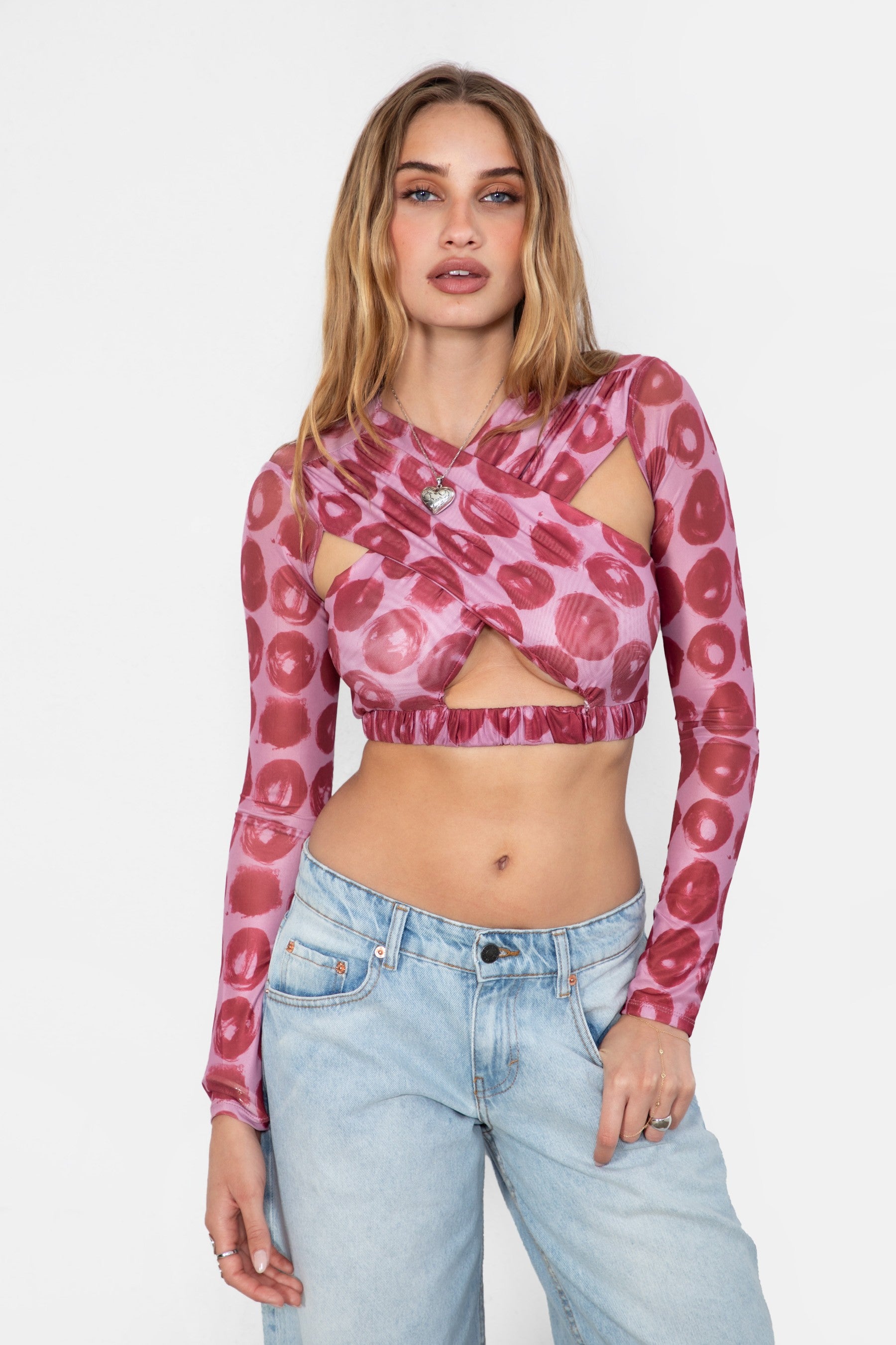 FOLSOM printed mesh long sleeve crop top with keyhole cutouts at the torso and shoulder