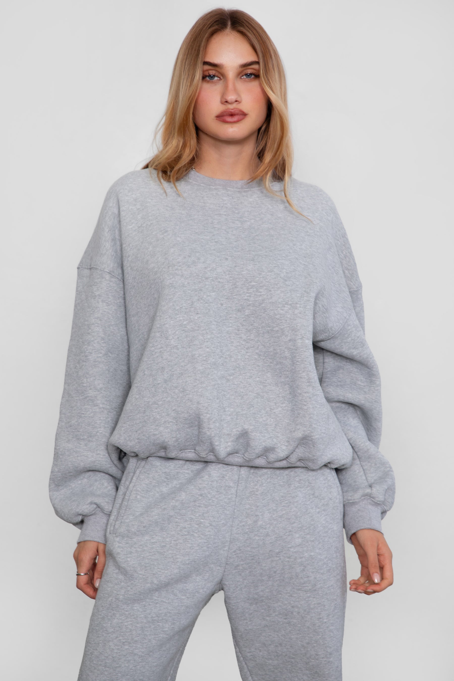 Relaxed fit fleece sweater for women with dropped shoulders and plush cozy fabric in heather  grey