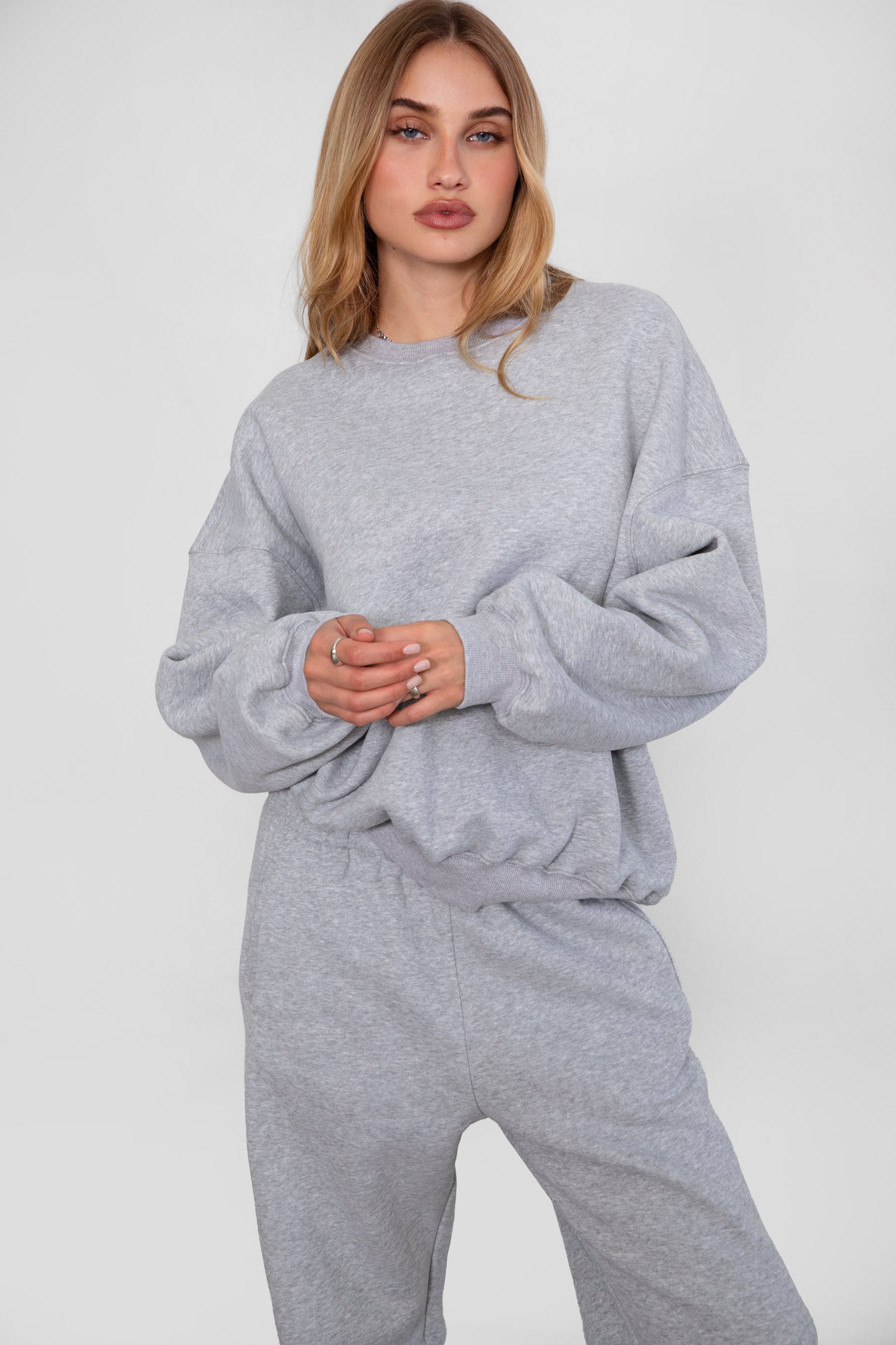 Relaxed fit fleece sweater for women with dropped shoulders and plush cozy fabric in heather  grey